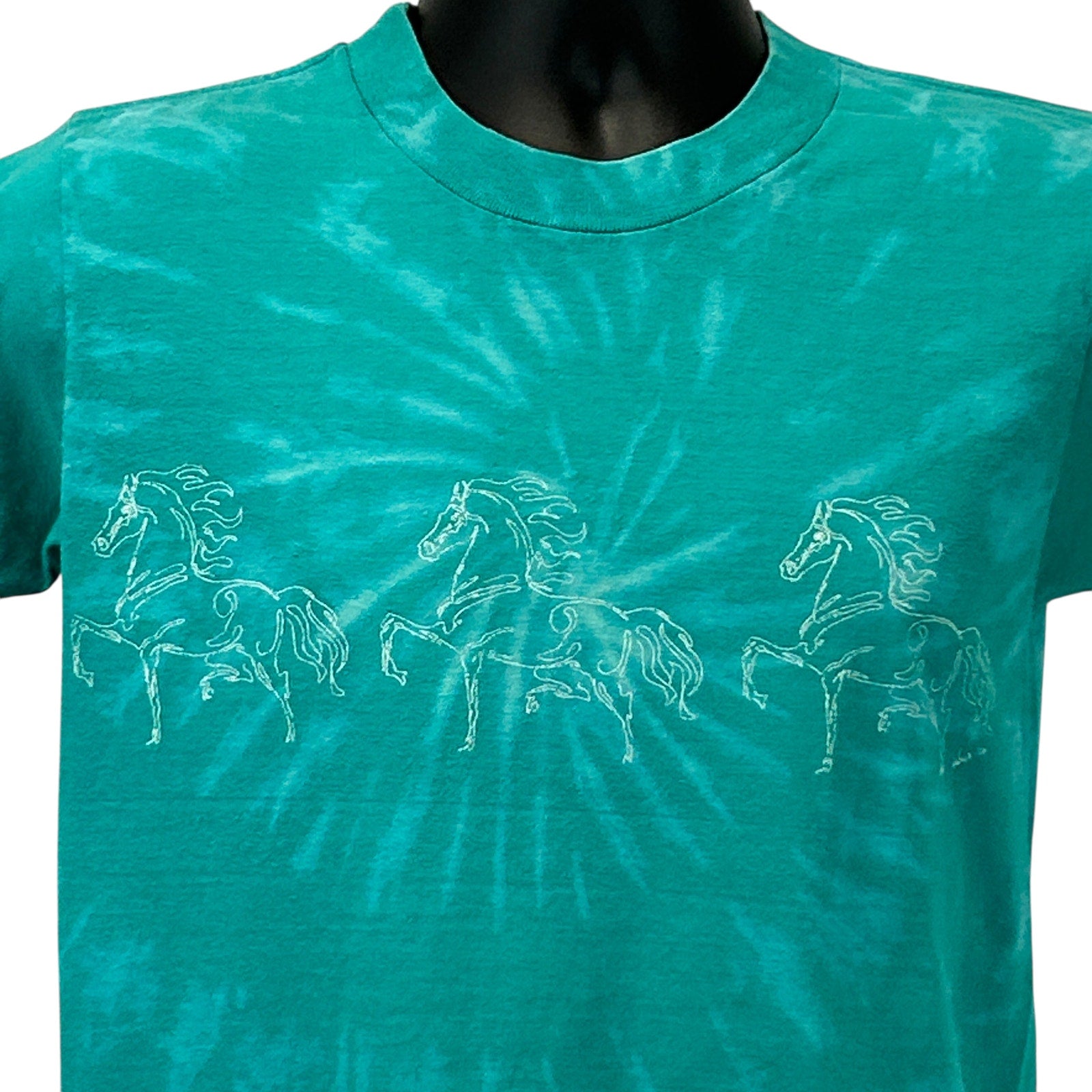 Vintage turquoise T-shirt with a front view showing three outlined horses, ideal for dressage enthusiasts