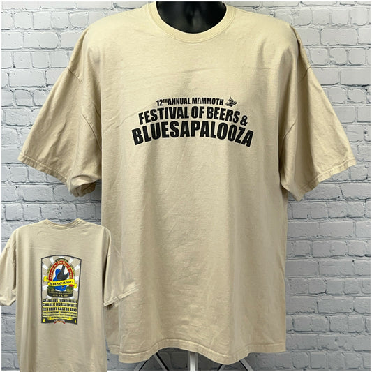 Front and back views of a beige Gildan Bluesapalooza T Shirt featuring a festival logo and vibrant graphics