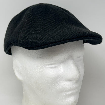 Black Flat Cap made from wool, side view showing a classic design and structured fit