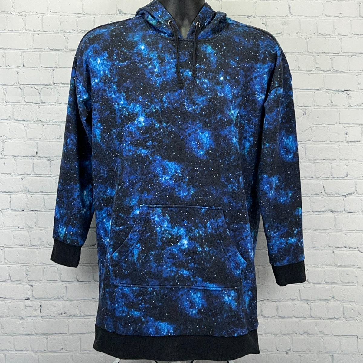 Galaxy-print oversized hoodie in dark blue with front pocket and drawstring hood from Hot Topic