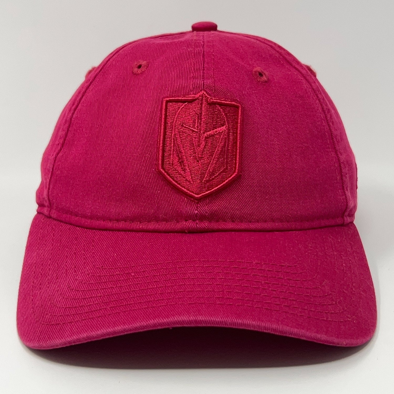 Front view of a pink New Era cap with a Golden Knights logo embroidered in red