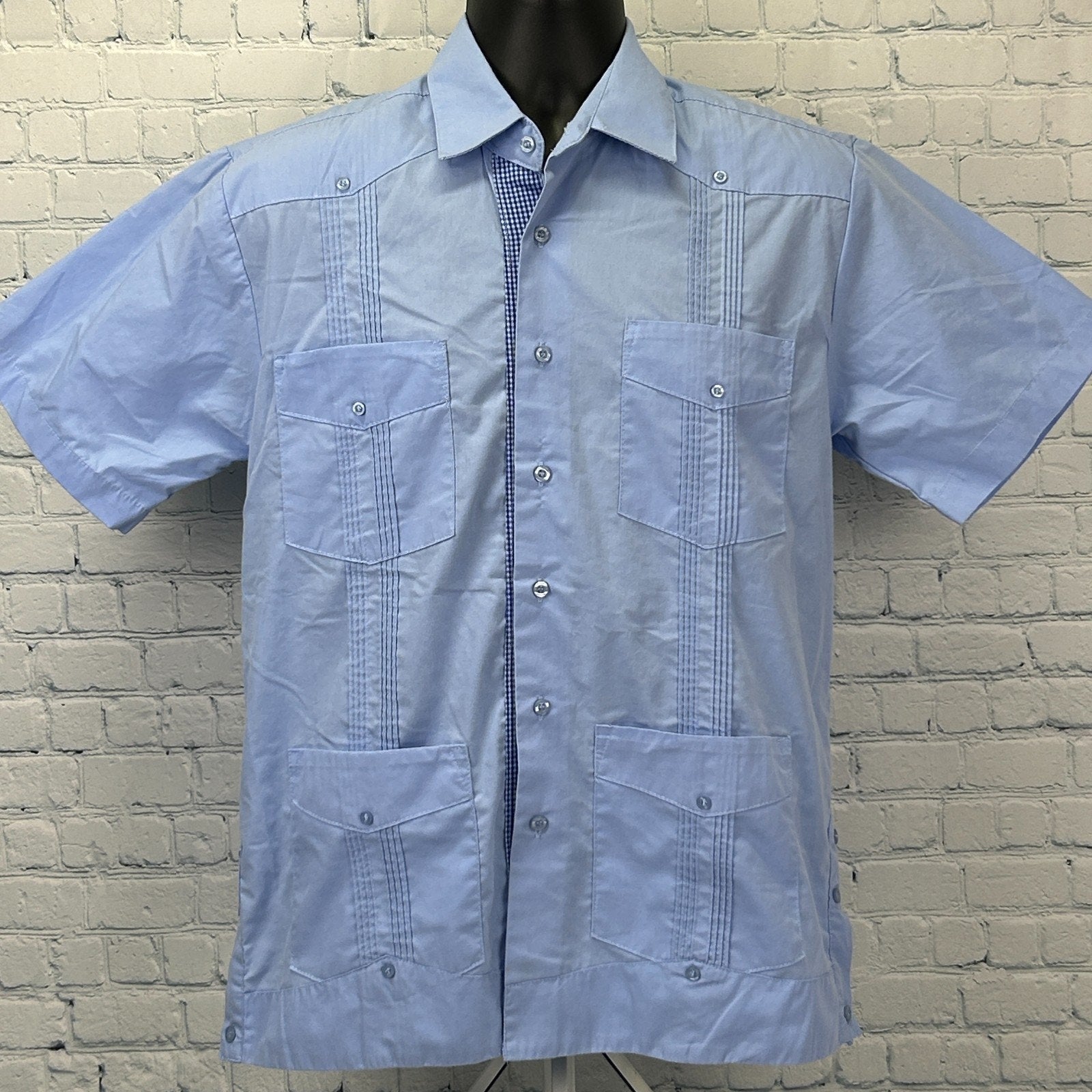 Light blue Guayabera Shirt in size medium featuring front pockets and detailed pleats