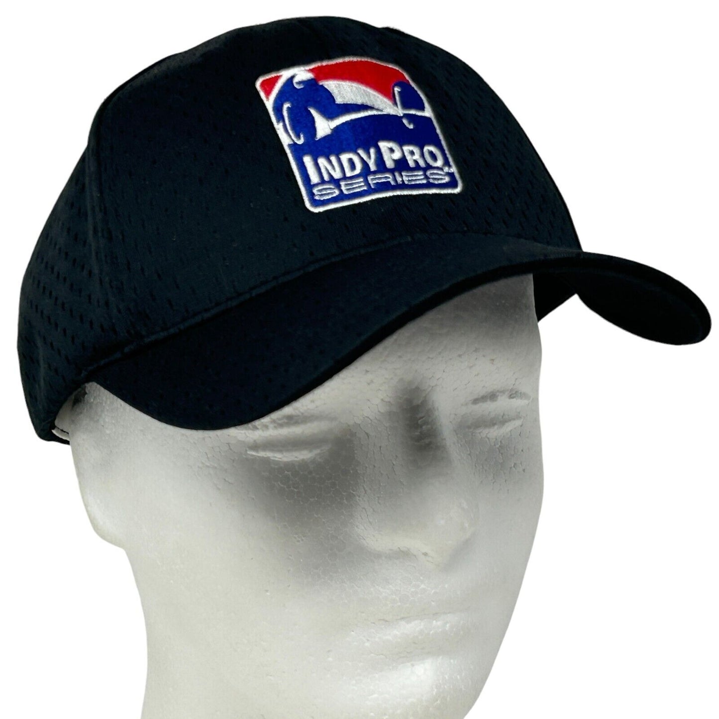 Black Indy Pro Series hat with embroidered logo, viewed from the front, featuring a breathable design.