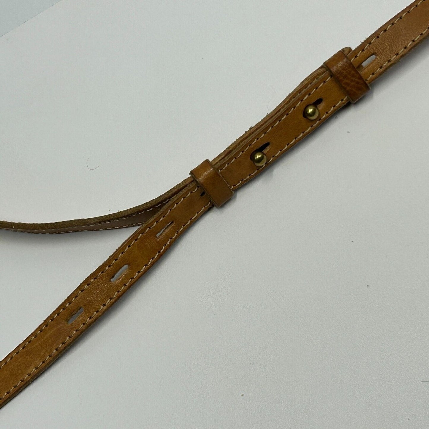 Madewell leather crossbody bag strap in brown with adjustable holes for a perfect fit
