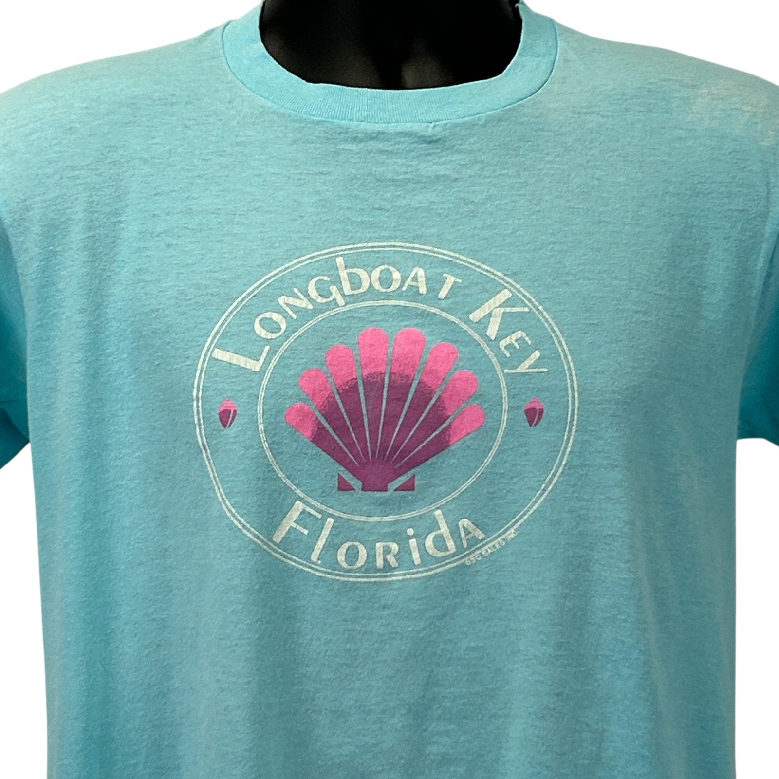 Vintage turquoise T-Shirt featuring a Longboat Key Florida shell logo on the front