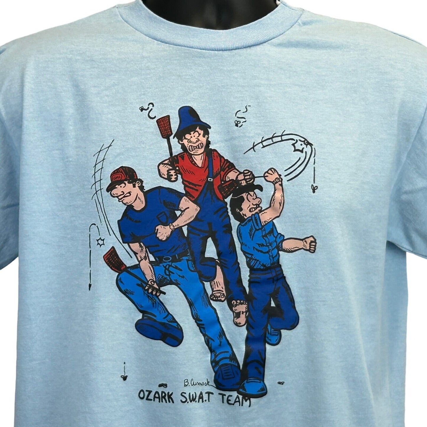 Light blue Vintage T-Shirt featuring Ozark SWAT Team graphic on the front with colorful cartoon characters