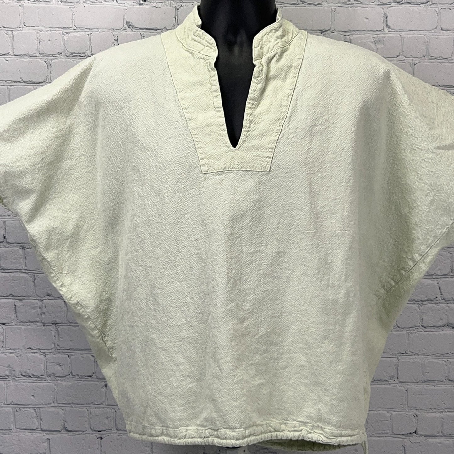 Light green oversized poncho with a V-neck design, perfect for casual wear