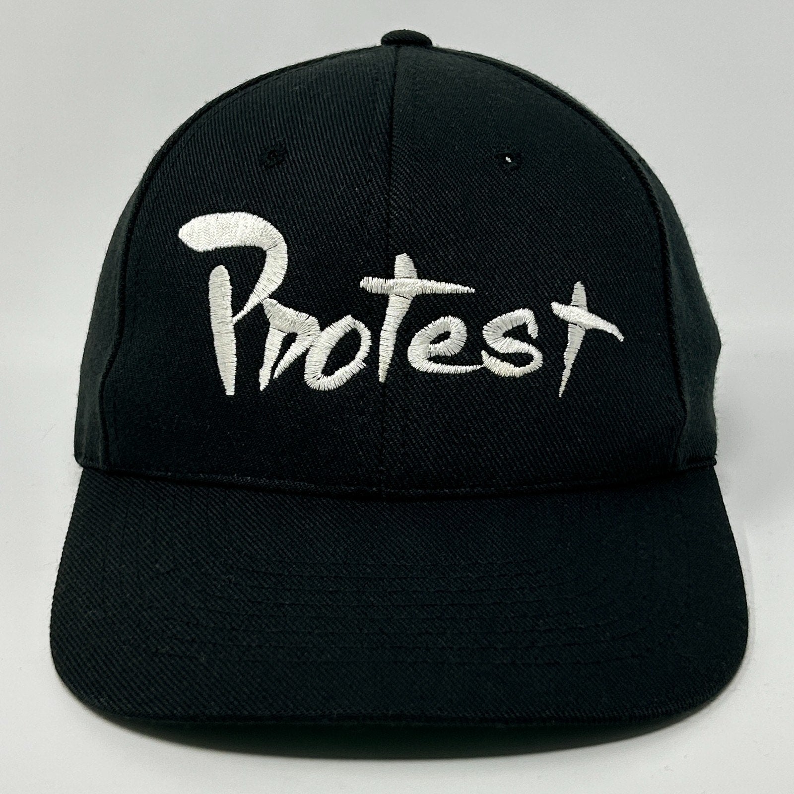 Black Protest Hat with White Embroidered Logo on Front for a Trendy Look