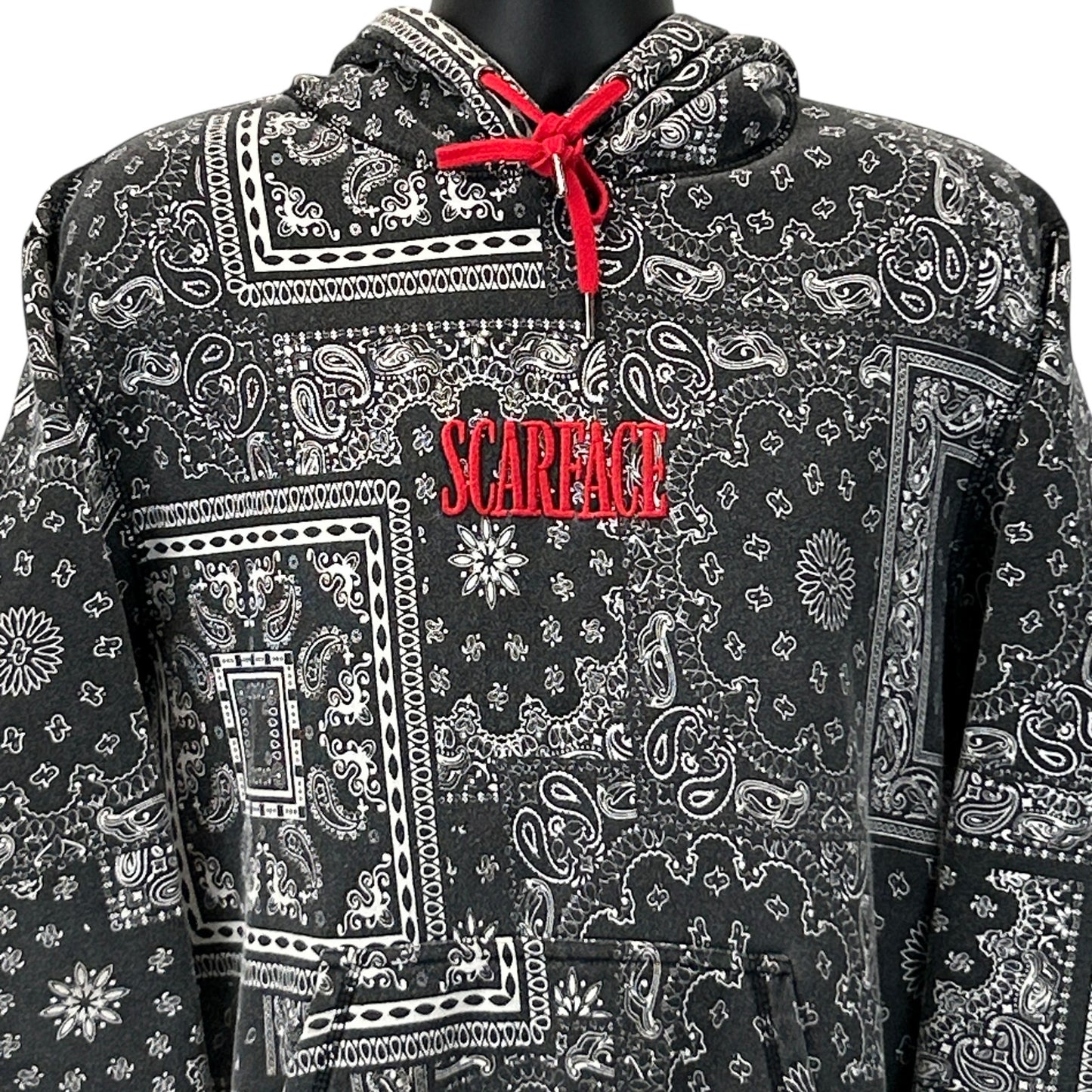 Black hoodie with SCARFACE graphic, front view featuring paisley print and red drawstring details