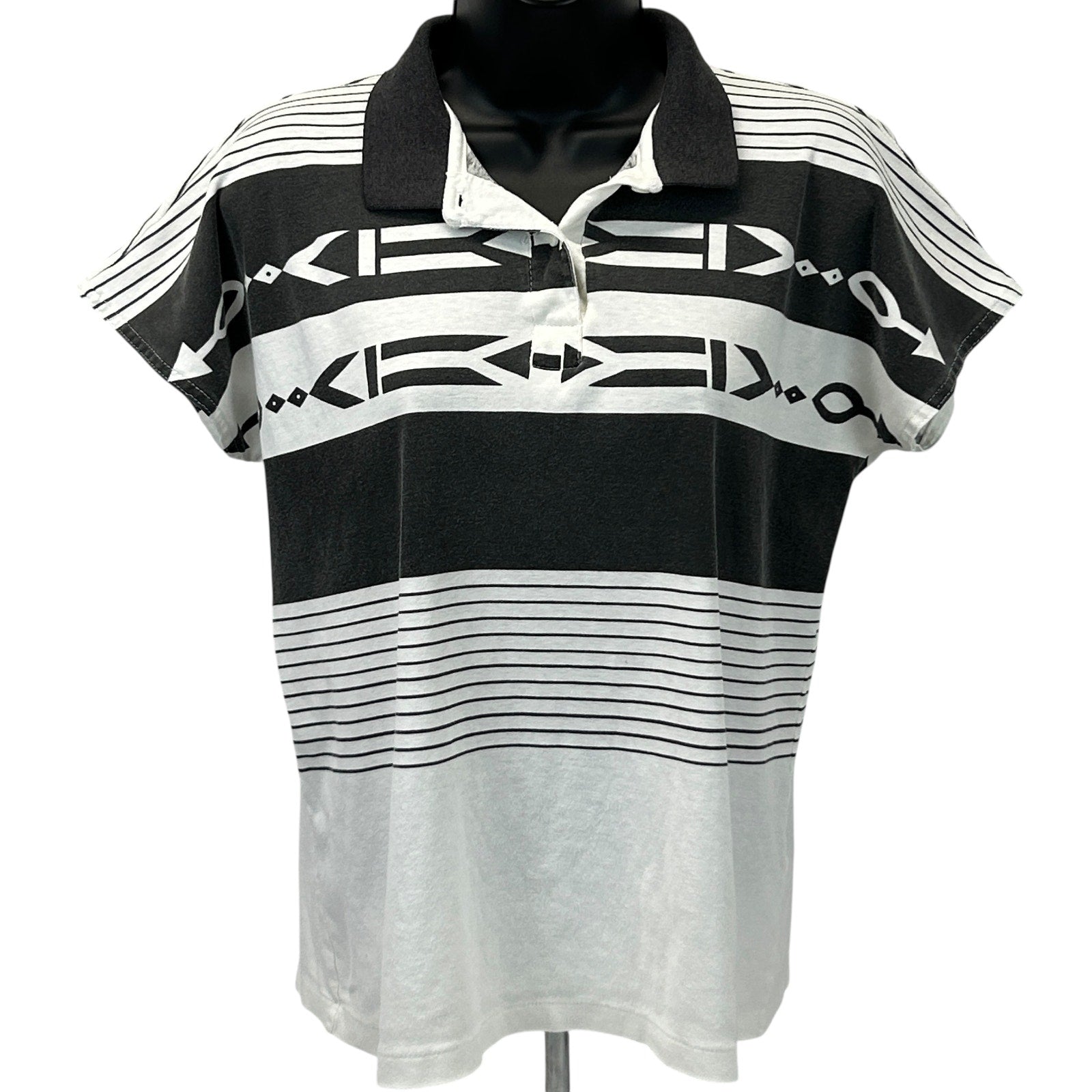 Head Tennis Polo Shirt in Black and White, Size Medium, Front View with Unique Pattern and Logo