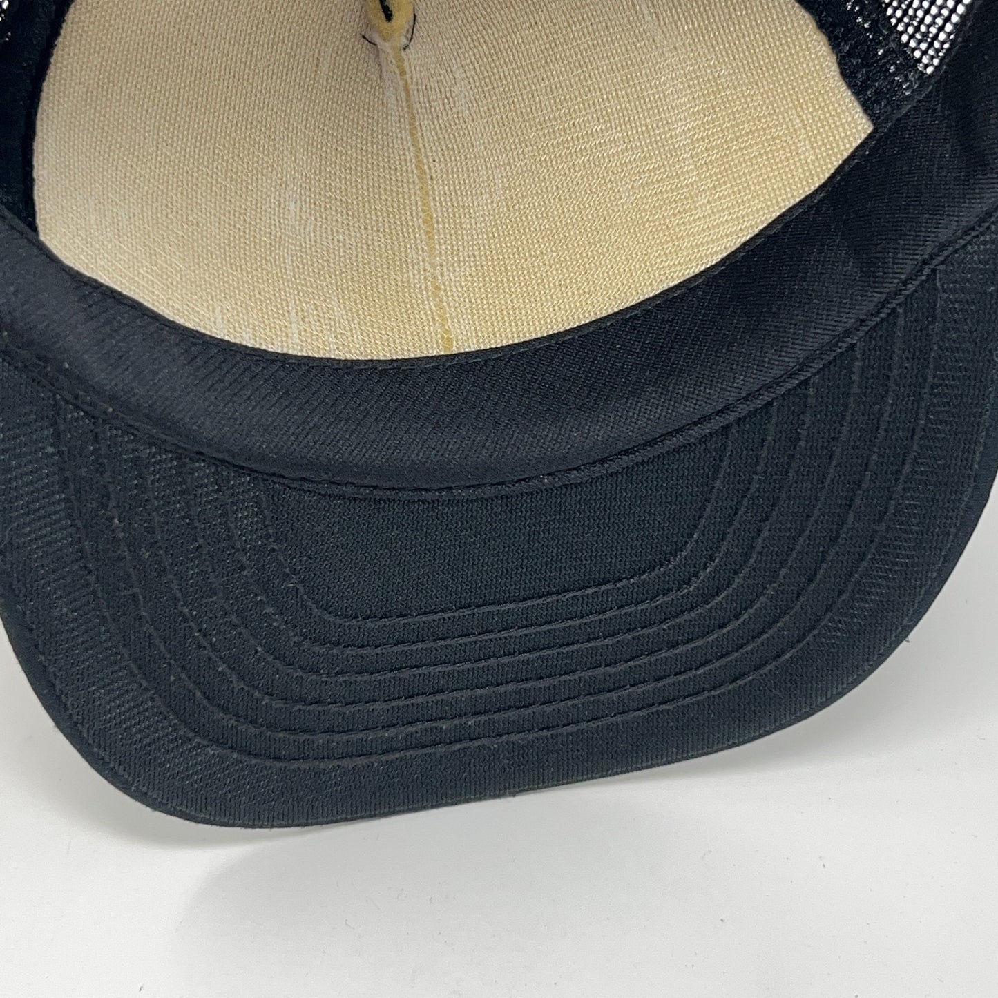 Vintage trucker cap in black, size adjustable, front view, classic design