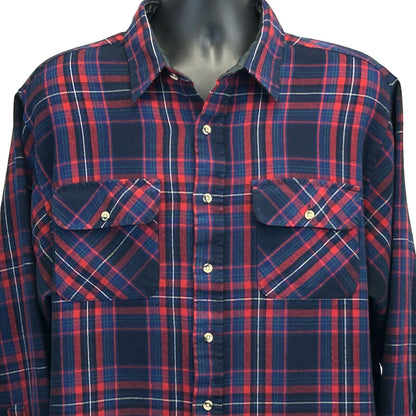 Vintage plaid shirt in navy and red featuring two front pockets and a classic fit