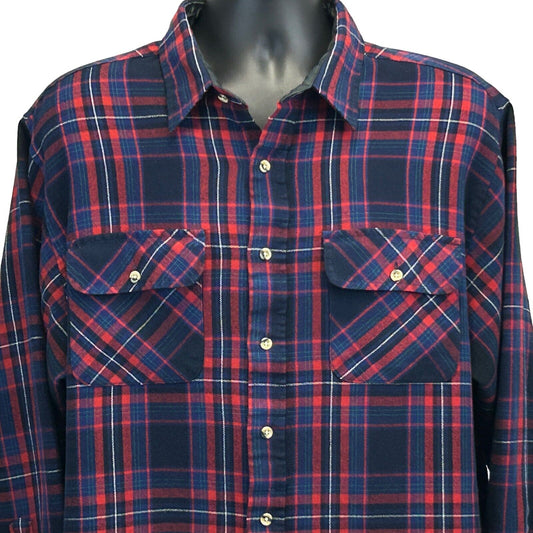 Vintage plaid shirt in navy and red featuring two front pockets and a classic fit