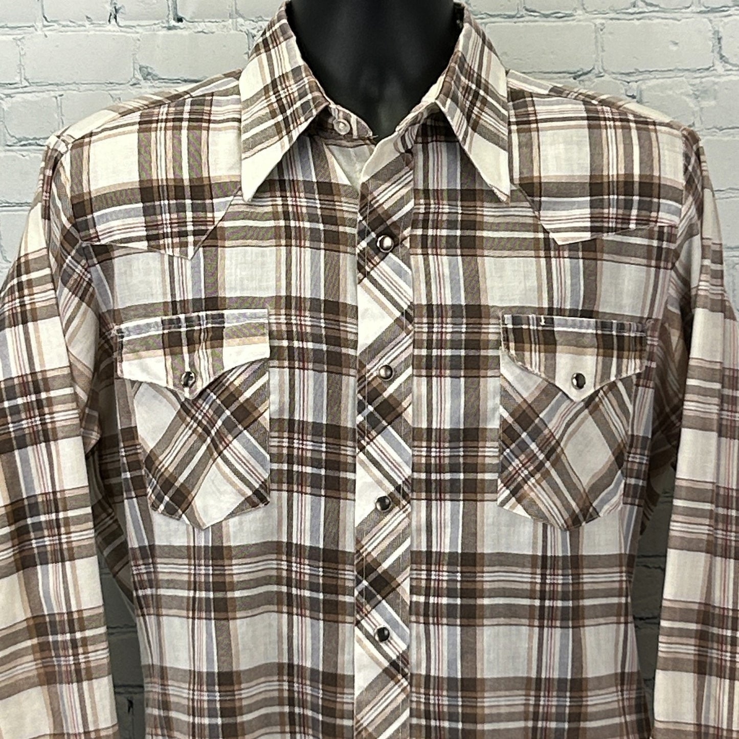 Front view of a Vintage Western Shirt in brown and cream plaid, featuring snap pockets and pointed yokes