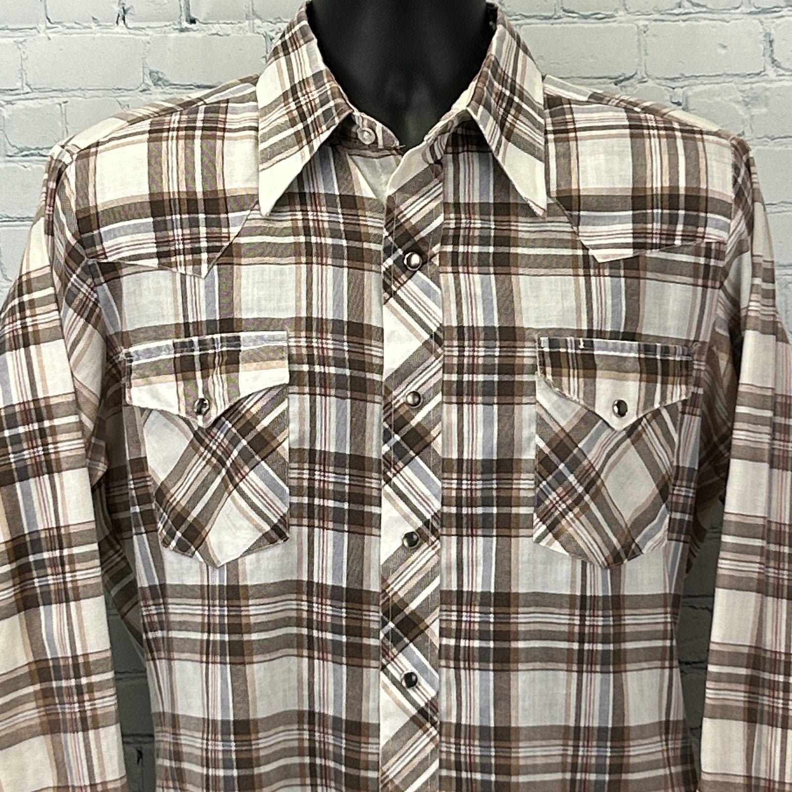 Front view of a Vintage Western Shirt in brown and cream plaid, featuring snap pockets and pointed yokes