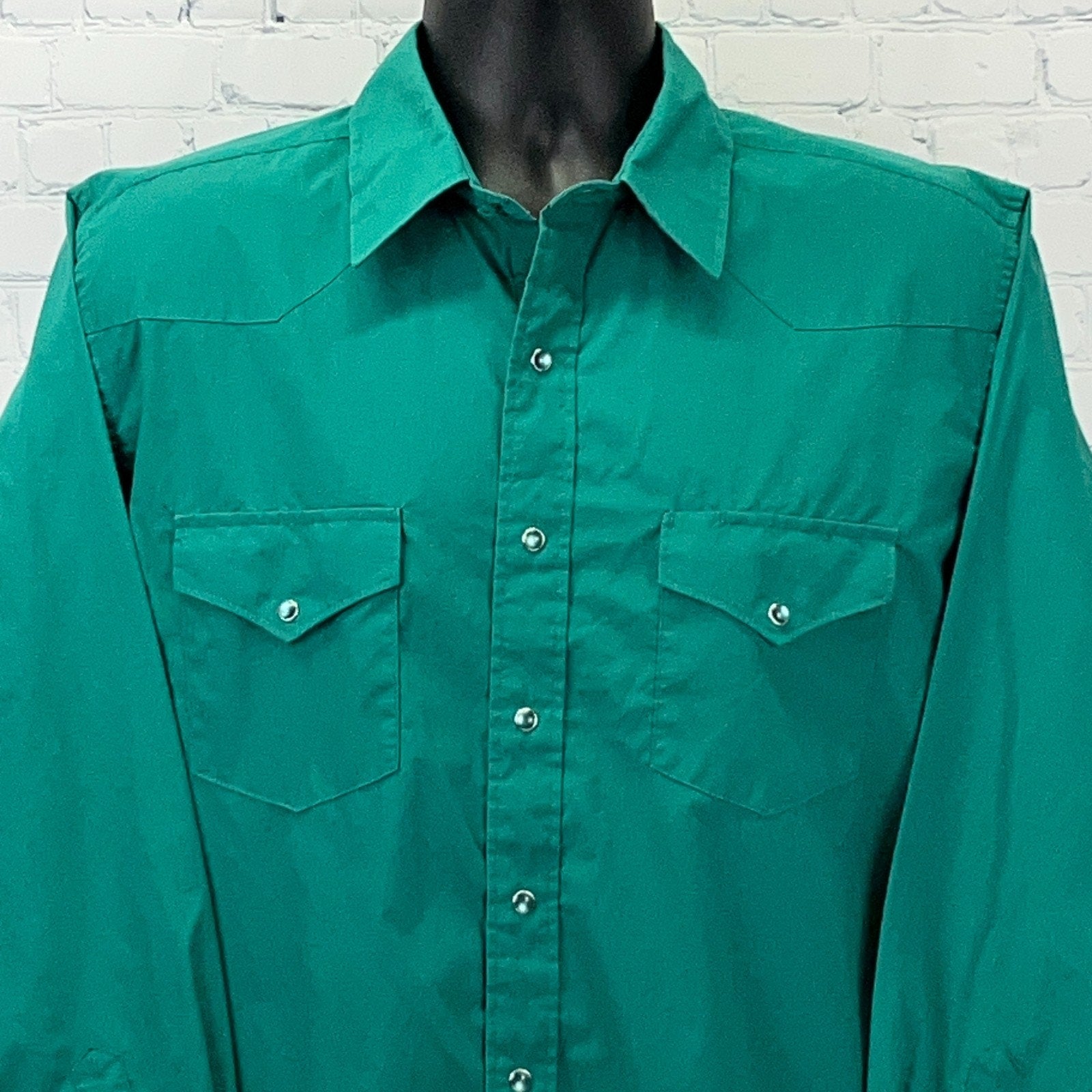 Front view of a vintage green Western Shirt with snap buttons and chest pockets