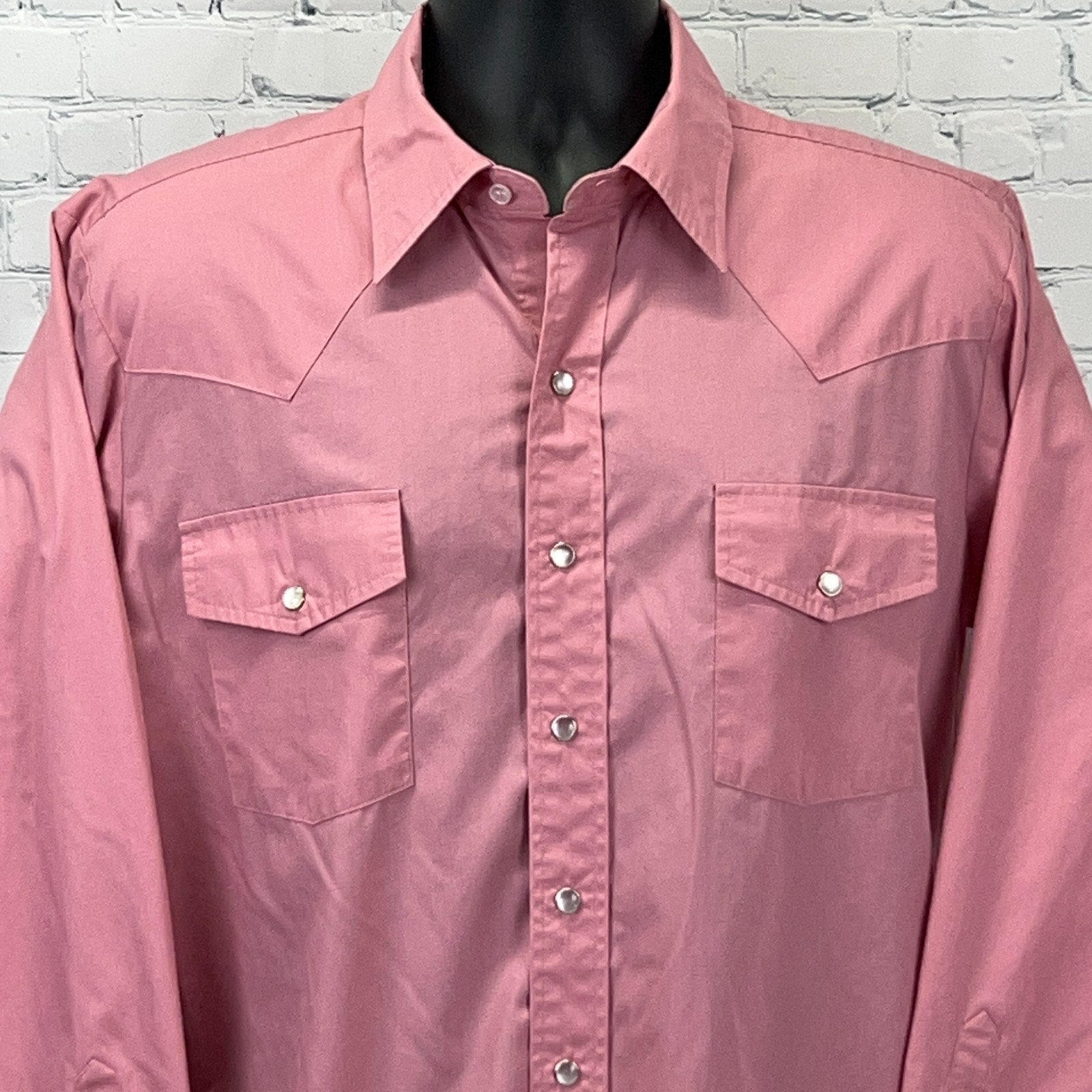 Front view of Malco Modes Western Shirt in pink, featuring classic snap buttons and dual chest pockets