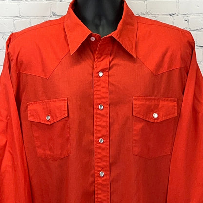 Front view of red Malco Modes Western Shirt featuring snap button closures and two chest pockets