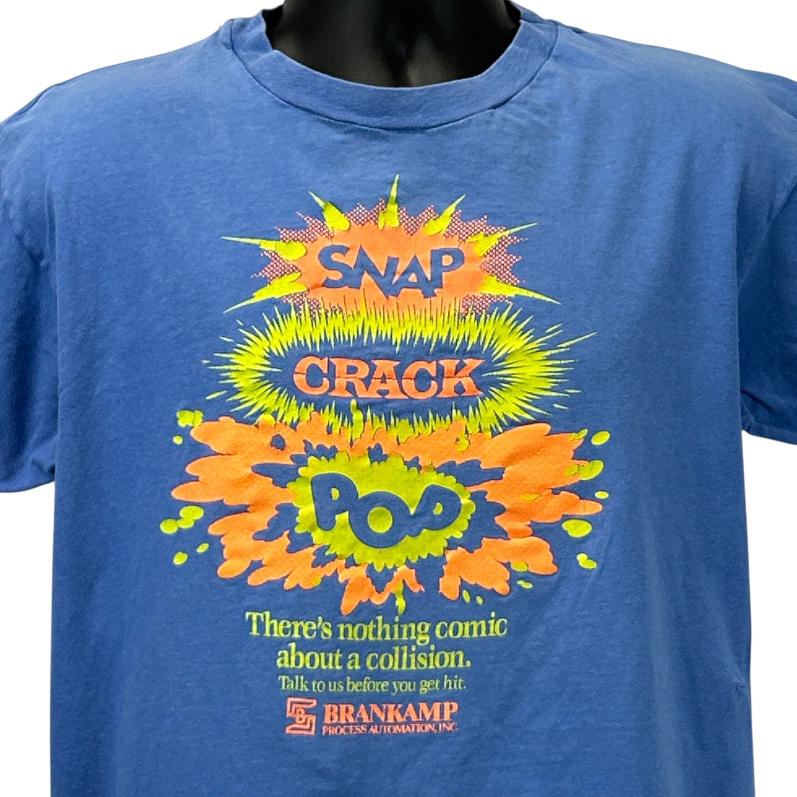 Front view of blue Hanes Vintage T Shirt with colorful comic-style graphics and logo