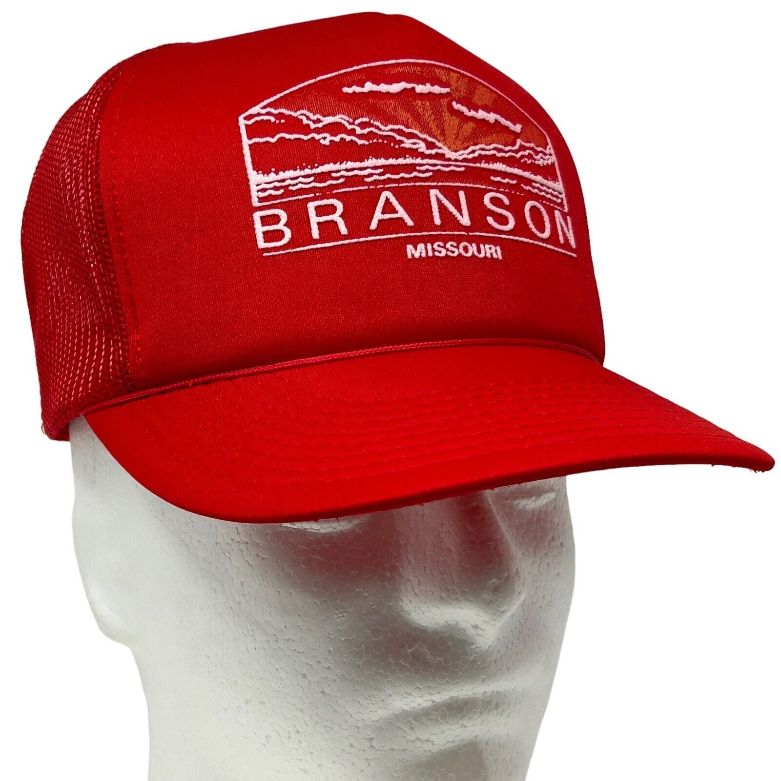 Red Vintage Branson Missouri Trucker Hat featuring a scenic logo view from the front