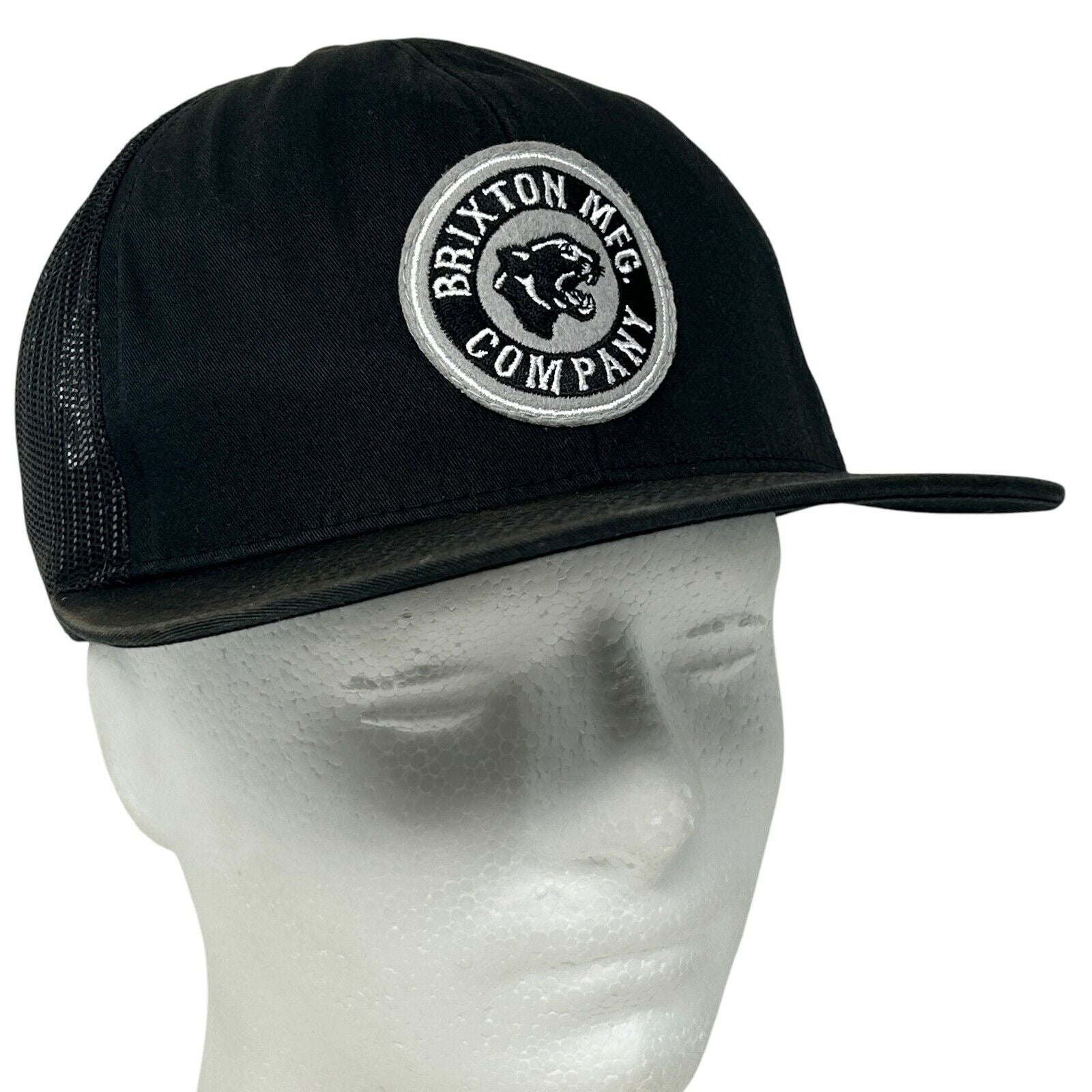 Front view of Brixton black mesh snapback hat with embroidered logo for casual style