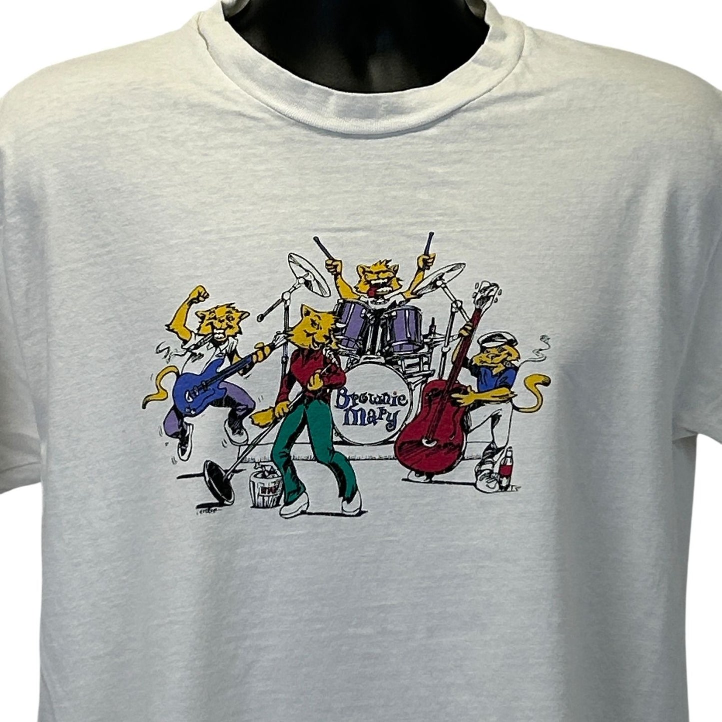 Vintage white T-shirt featuring a colorful Brownie Mary Band graphic on the front with musicians and instruments