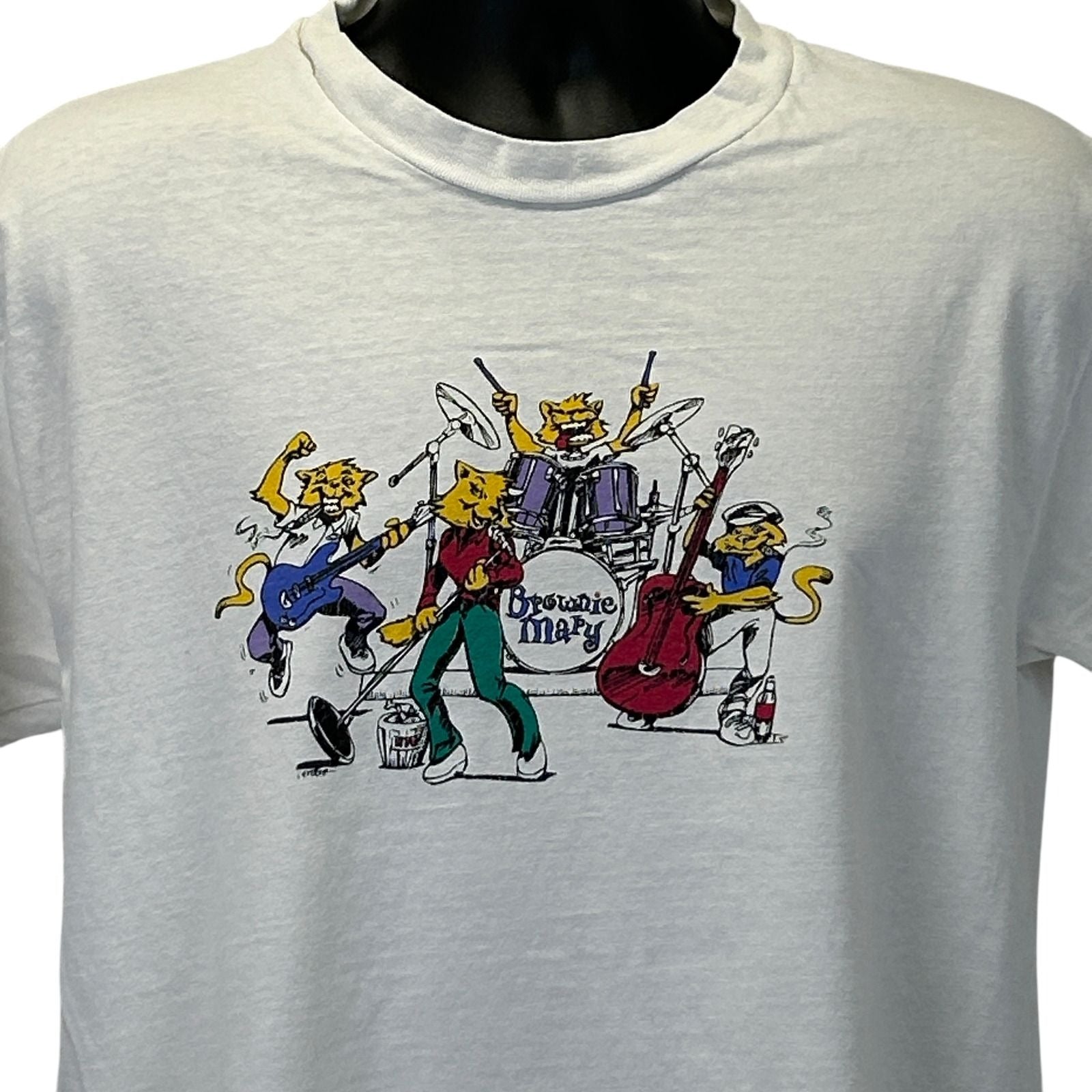 Vintage white T-shirt featuring a colorful Brownie Mary Band graphic on the front with musicians and instruments