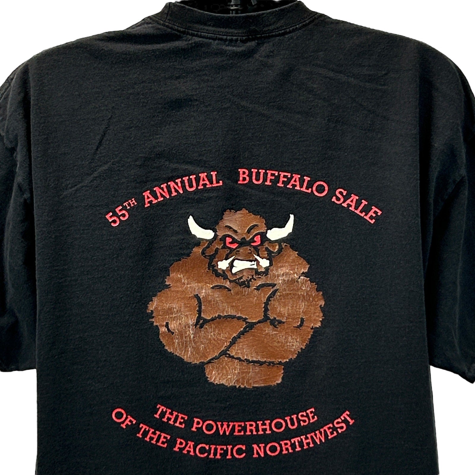 Port and Company Black T-Shirt with a Buffalo Sale graphic on the back, featuring Seattle-themed design