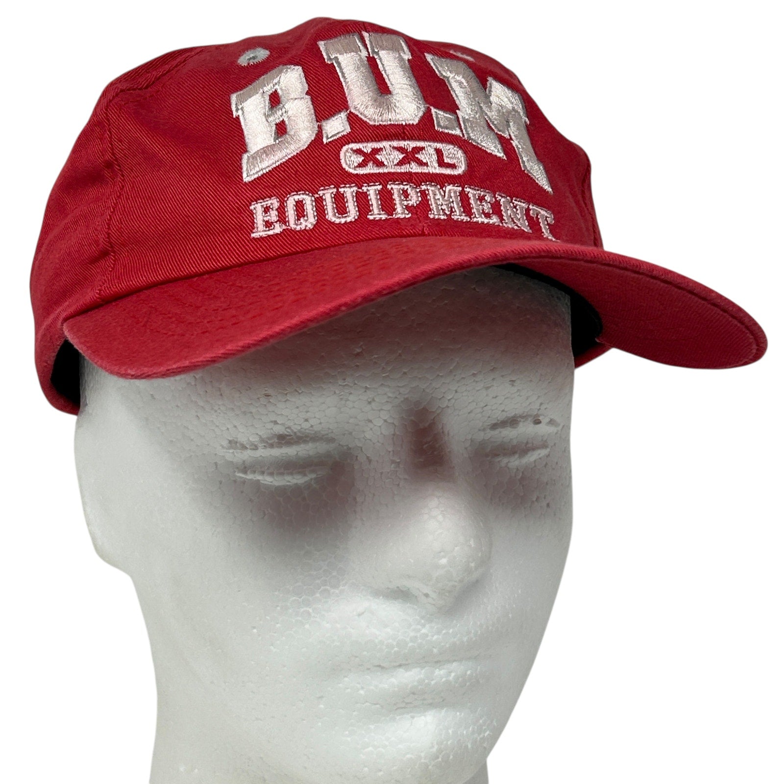 Front view of a red B.U.M. Equipment hat in XXL with embroidered logo and adjustable back strap
