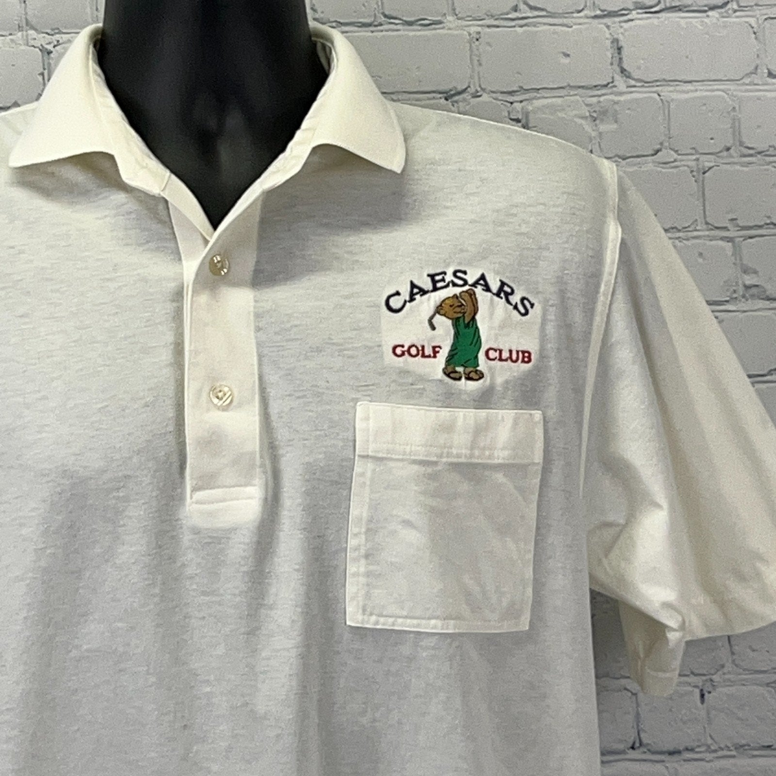 White Caesars Golf Polo with embroidered logo and front pocket, size medium, front view