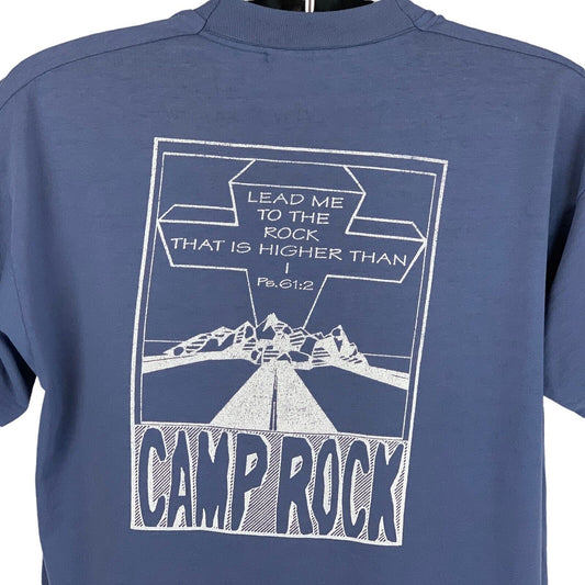 Back view of blue Christian T-shirt featuring a rock graphic and inspirational text.