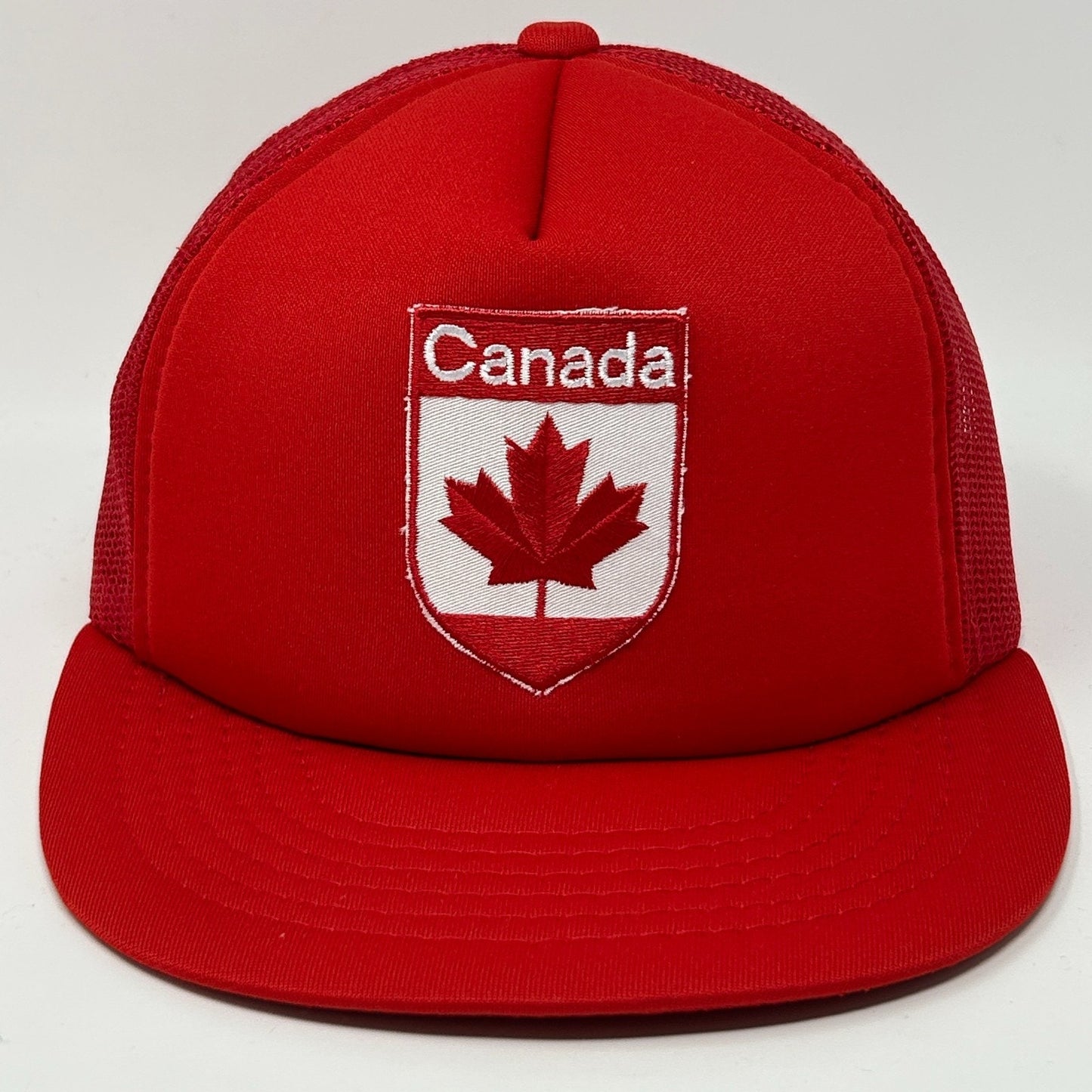 Red Canada Hat featuring embroidered maple leaf logo and adjustable snapback design