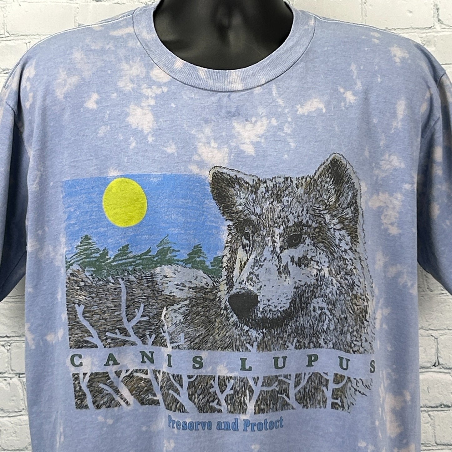 Vintage Wolf T Shirt in blue with graphic print of a wolf and text 'Canis Lupus' on the front
