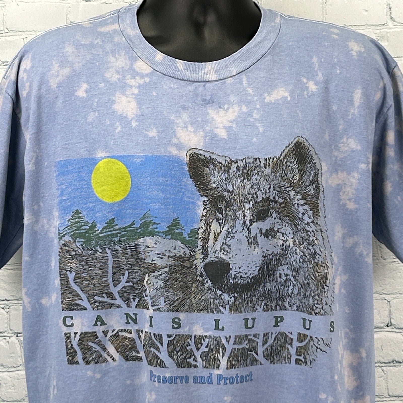 Vintage Wolf T Shirt in blue with graphic print of a wolf and text 'Canis Lupus' on the front