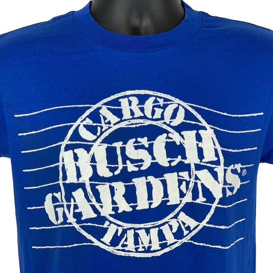 Front view of blue T-shirt featuring white Busch Gardens Tampa logo with 'Cargo' detail