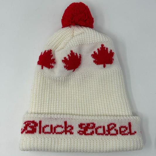 White Carling Black Label Beanie with red pompom and Canadian leaf designs on the front