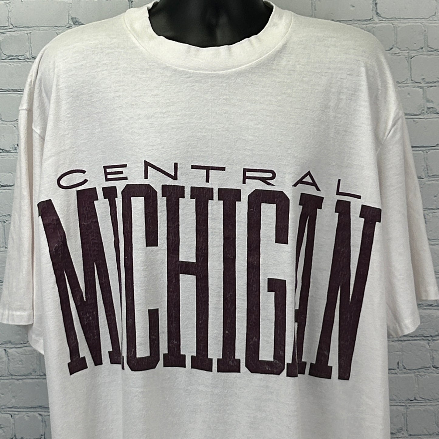 Vintage white Central Michigan T Shirt featuring bold maroon lettering on the front, relaxed fit