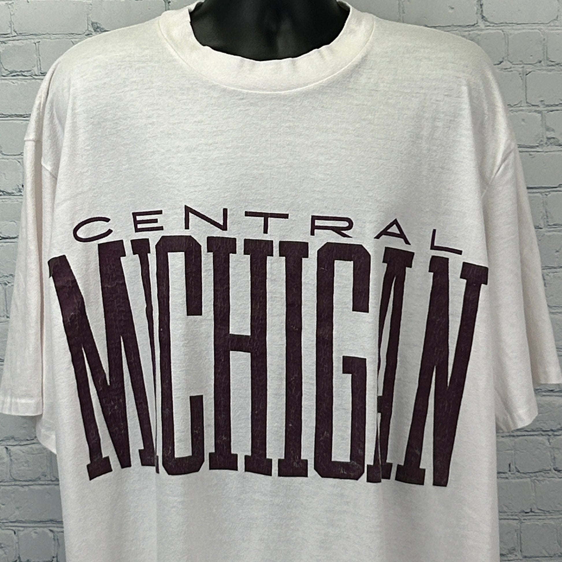 Vintage white Central Michigan T Shirt featuring bold maroon lettering on the front, relaxed fit