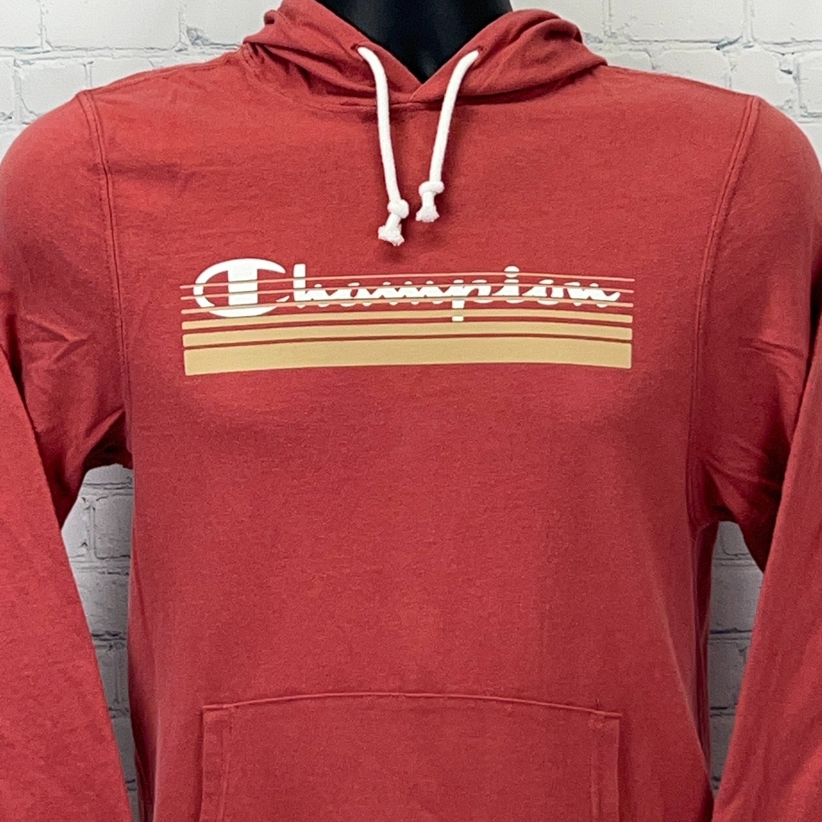 Red Champion hoodie in men's large featuring a striped logo design on the front