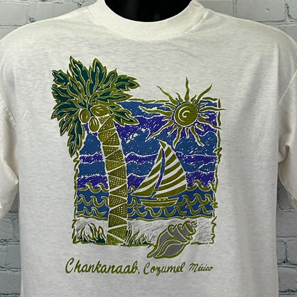 Front view of Vintage Cozumel T Shirt in cream featuring palm trees, sun, and sailboat design