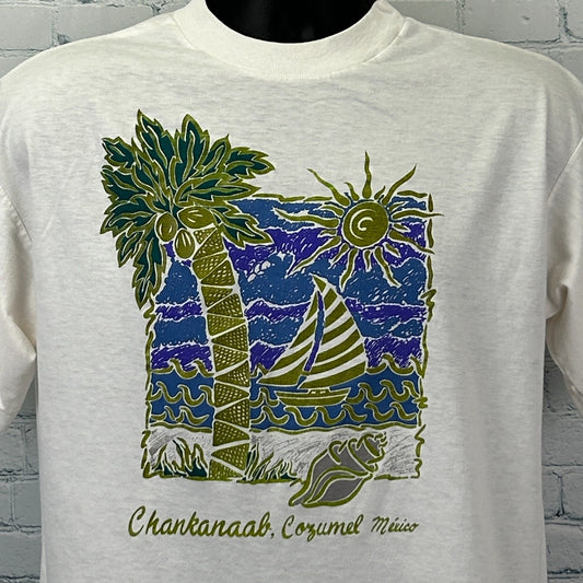 Front view of Vintage Cozumel T Shirt in cream featuring palm trees, sun, and sailboat design
