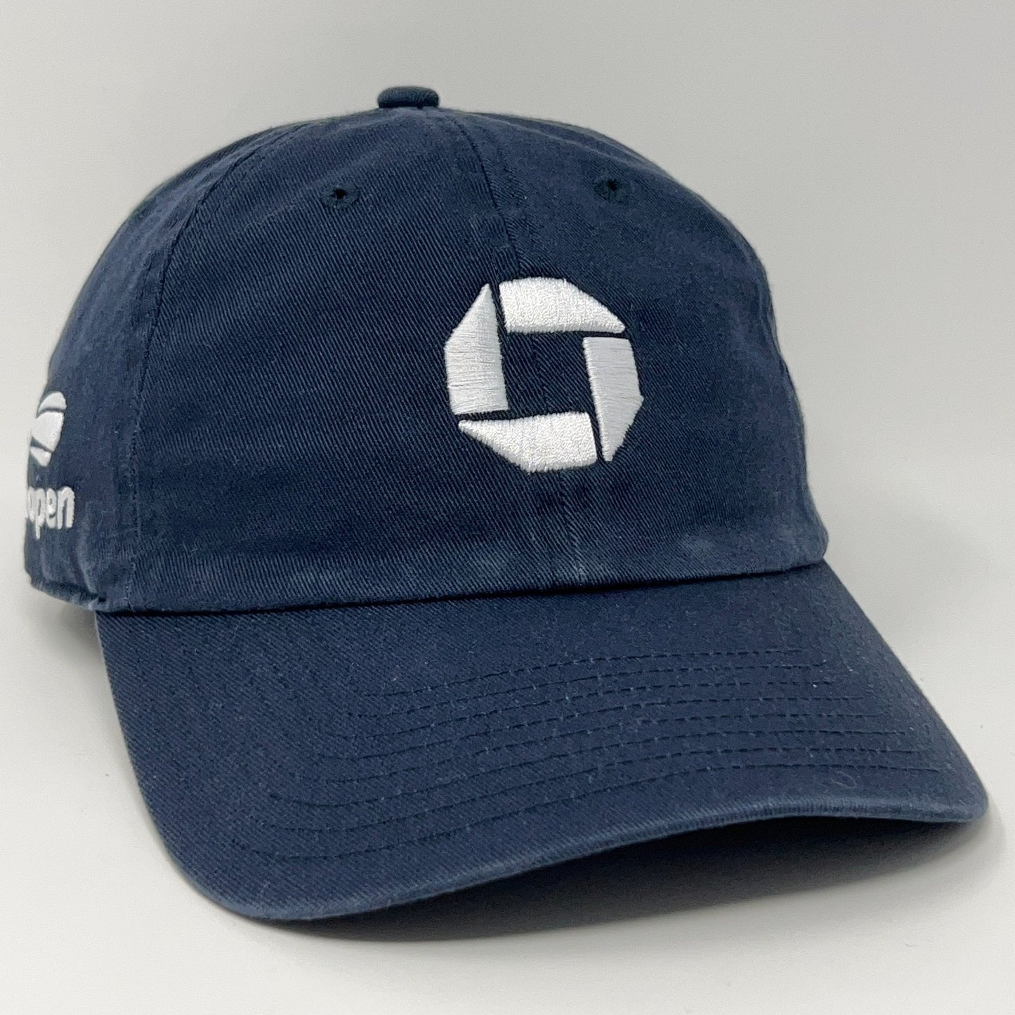 Navy US Open Chase Bank cap featuring a front logo and adjustable strap for a comfortable fit