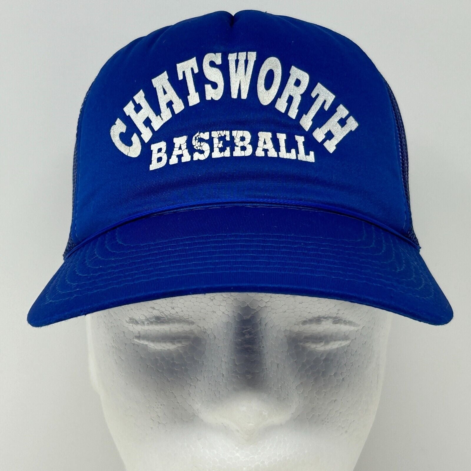 Front view of vintage blue Chatsworth Baseball hat with curved brim and white lettering