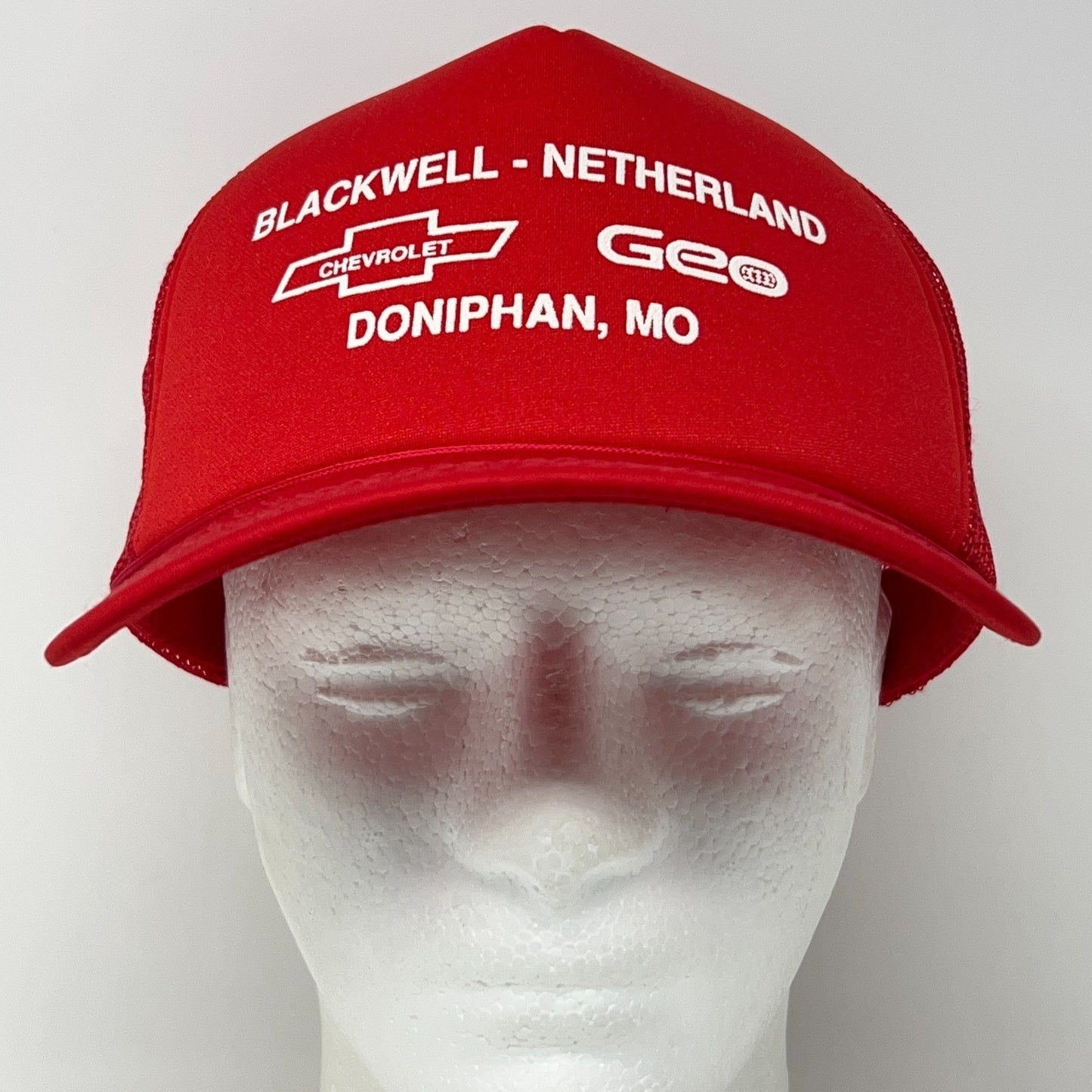 Vintage red Chevrolet hat from the 1990s with front view branding and adjustable size