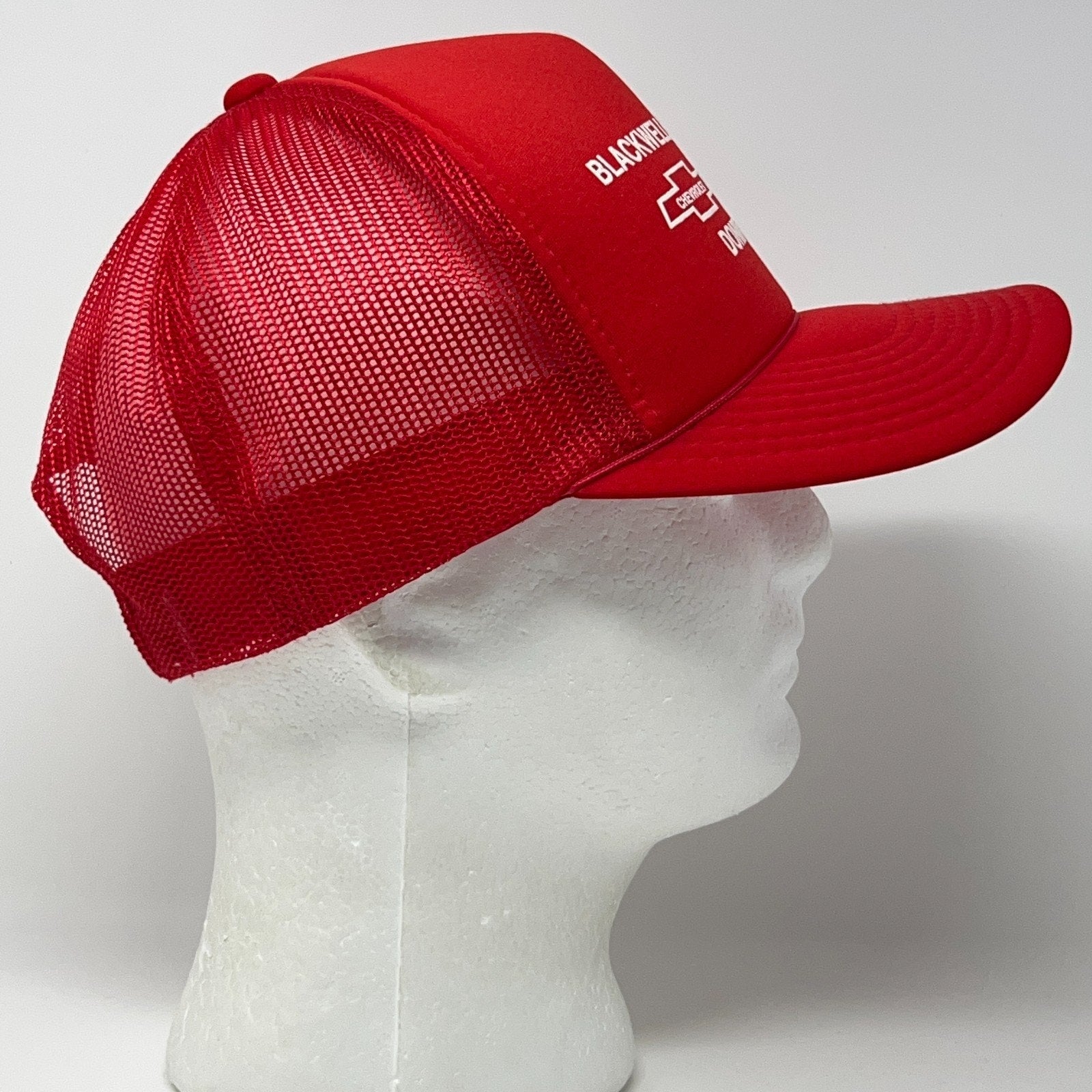 Vintage red Chevrolet trucker hat with mesh back, side view, one size fits all