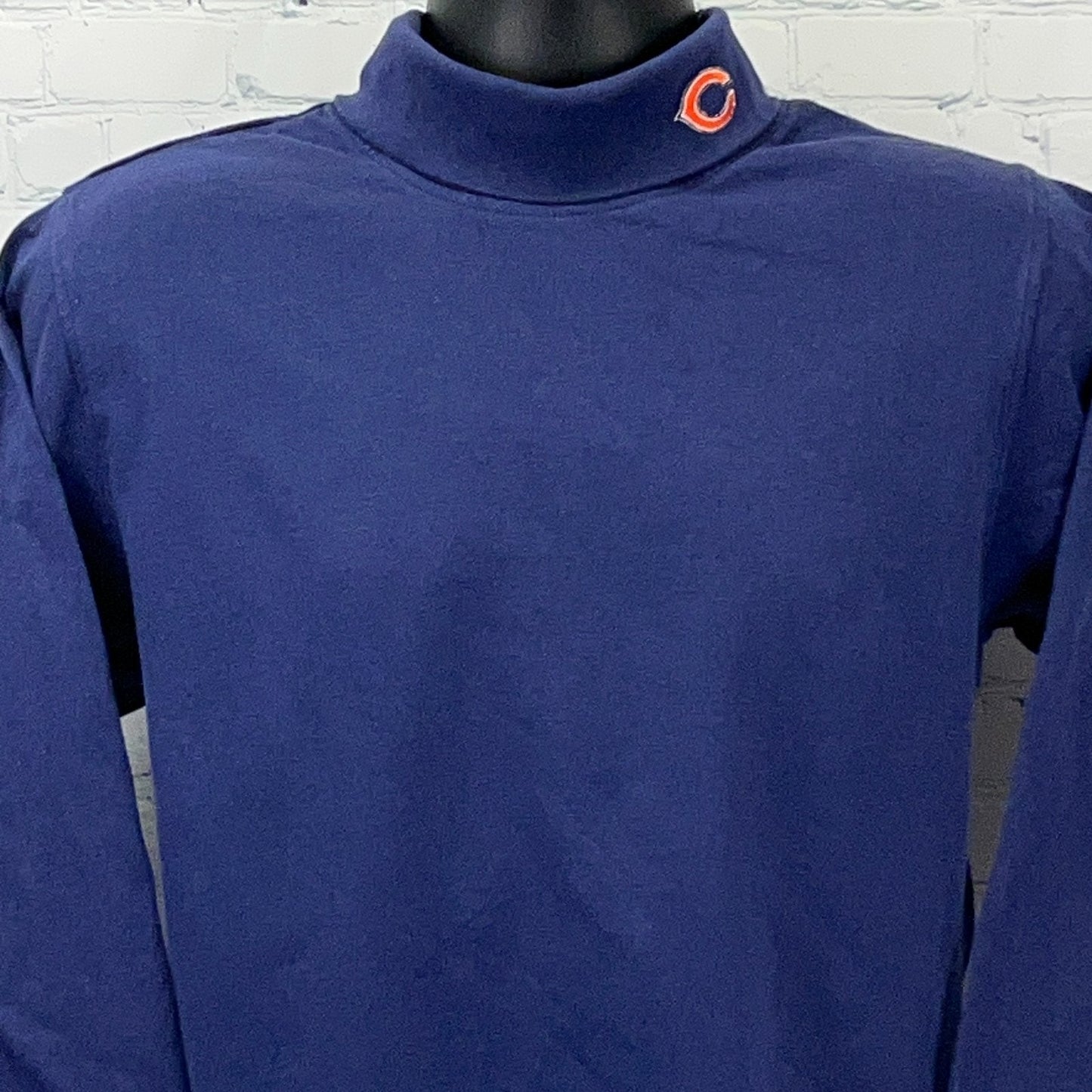 Majestic Chicago Bears navy long sleeve polo with a mock collar and logo on the neck area
