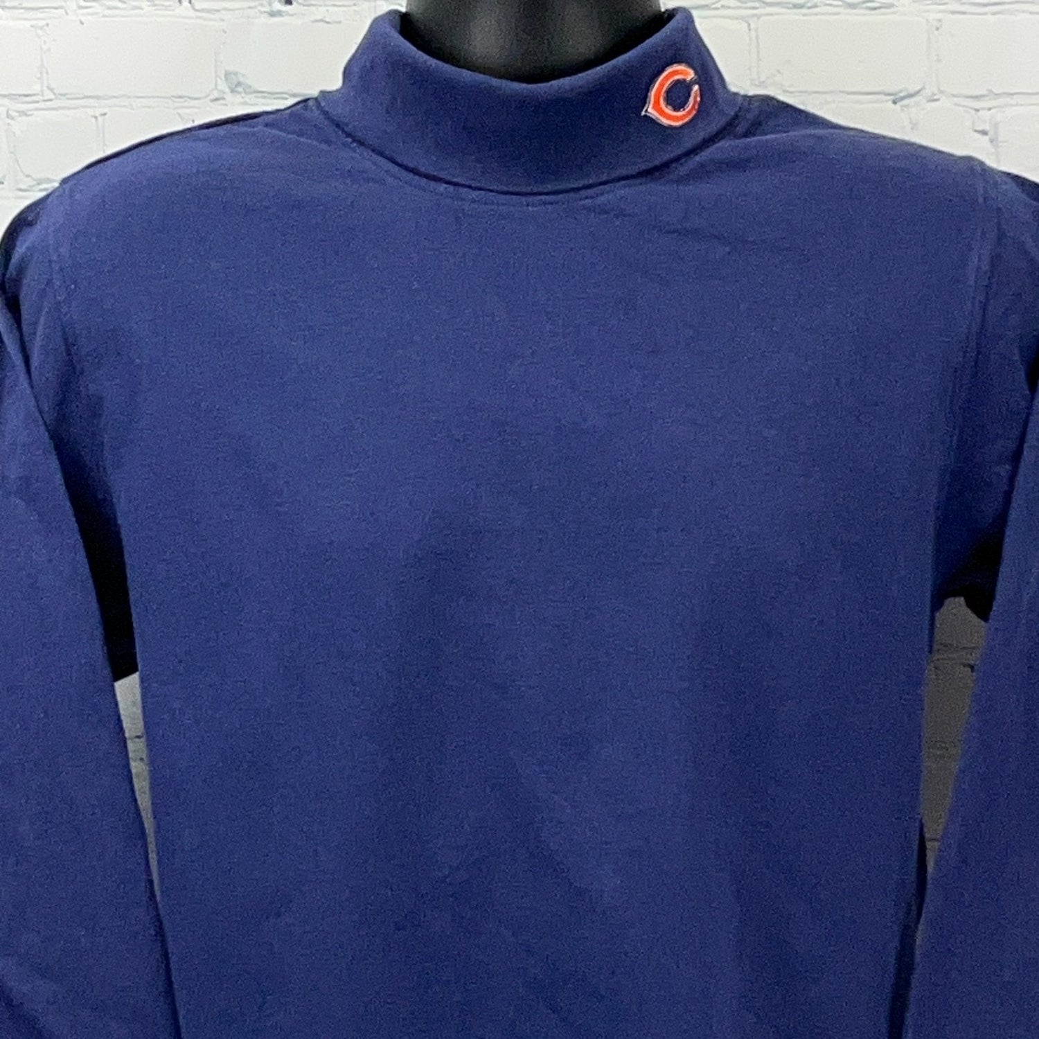 Majestic Chicago Bears navy long sleeve polo with a mock collar and logo on the neck area