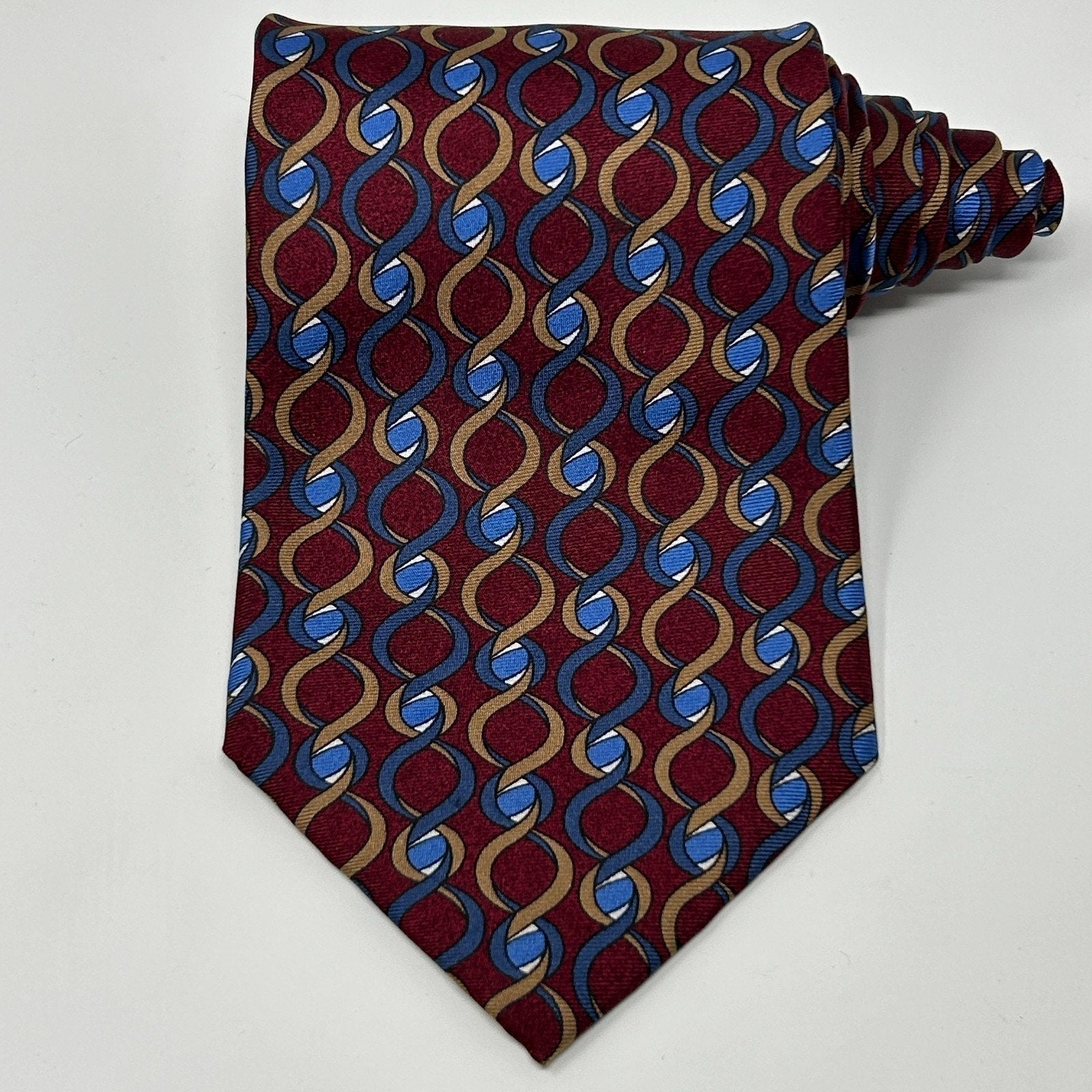 Christian Dior Necktie in burgundy and blue with interlocking pattern, featuring a stylish pointed tip