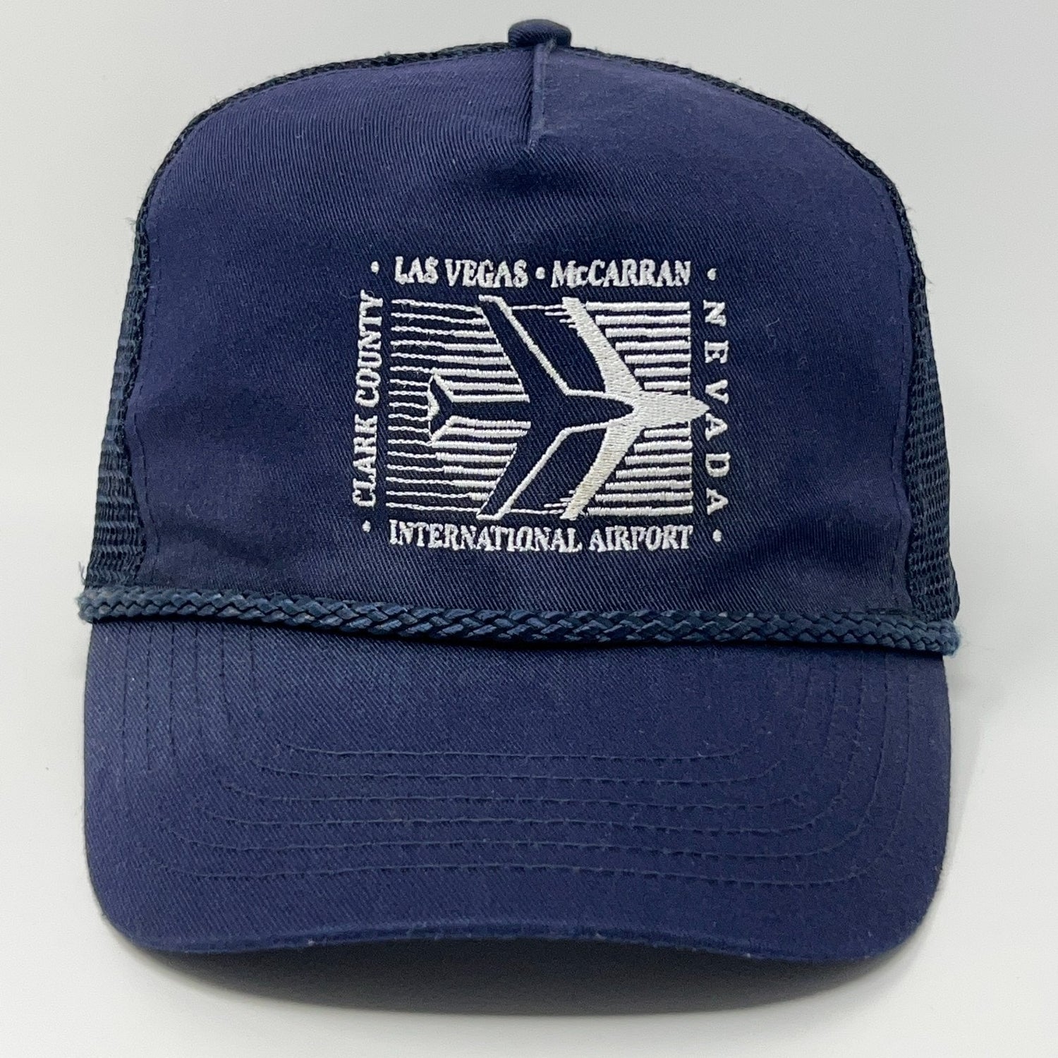 Vintage navy blue trucker hat featuring Las Vegas McCarran Airport logo with airplane design