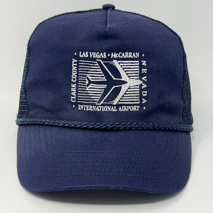 Vintage navy blue trucker hat featuring Las Vegas McCarran Airport logo with airplane design